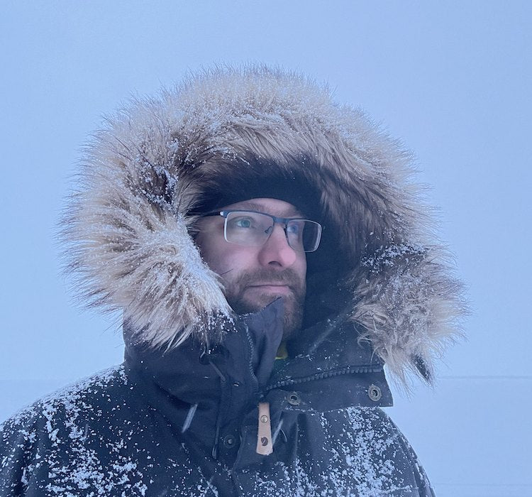 Jussi Niittyviita in a fur-hooded parka in the northern Finnish winter